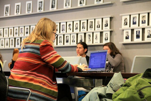 Experimental Modes convening attendees using laptops, pens, food, and phones for their work. Photo by Daniel O'Neil. 